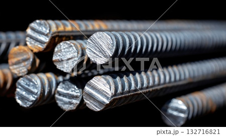 Close-up of shiny metal rebars with detailed texture and industrial background Close-up of shiny metal rebars with detailed texture and industrial background 132716821