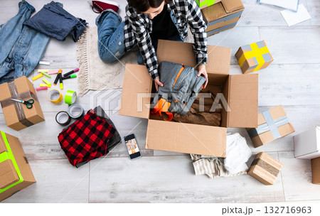 Girl Packing Cardboard Boxes And Girl Packing Cardboard Boxes Girl Packing Cardboard Boxes And Girl Packing Cardboard Boxes 132716963