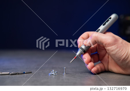 Electric mini screwdriver and several different interchangeable bits Electric mini screwdriver and several different interchangeable bits 132716970