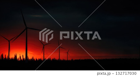 Silhouette of wind turbines during dramatic red sunset over forest horizon Silhouette of wind turbines during dramatic red sunset over forest horizon 132717030