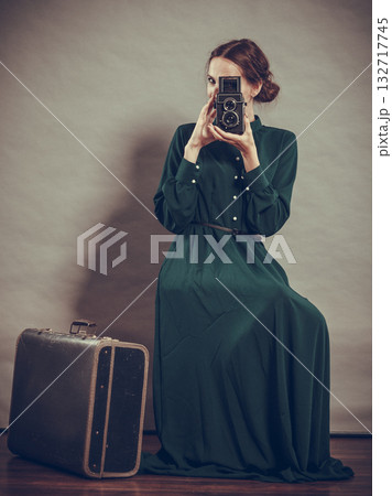 Woman retro style with old suitcase camera Woman retro style with old suitcase camera 132717745