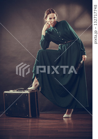 Woman retro style with old suitcase and fan 132717748