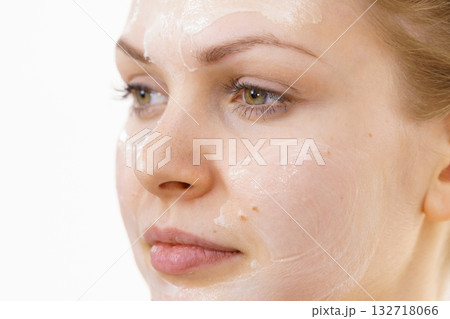 Girl with cream moisture cosmetic on face 132718066