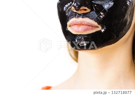 Woman with black peel off mask on face 132718077