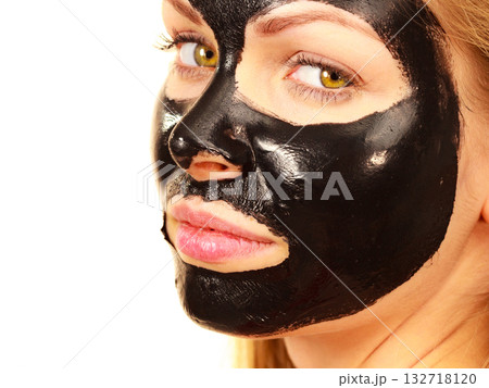 Girl black carbo peel off mask on face 132718120