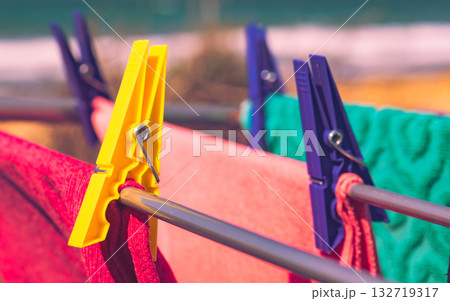 Clothes hanging to dry outdoor on sea coast Clothes hanging to dry outdoor on sea coast 132719317