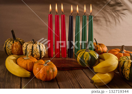 Kwanzaa. African holiday Kwanzaa with decoration of seven candles and pumpkins 132719344