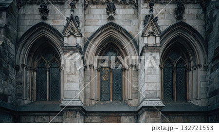 Gothic Cathedral Windows With Intricate Stonework. Architectural Detail Of Historic Building Gothic Cathedral Windows With Intricate Stonework. Architectural Detail Of Historic Building 132721553