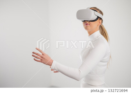 Woman Exploring Virtual Reality Technology Woman Exploring Virtual Reality Technology 132721694