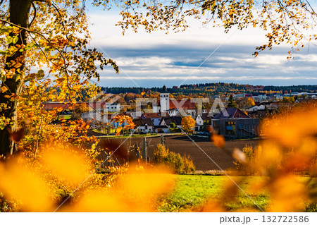 Church In Gilching, Bavaria: Picturesque Autumn Village Landscape With Colorful Trees, Golden Fields, And Dramatic Sky Near Munich 132722586
