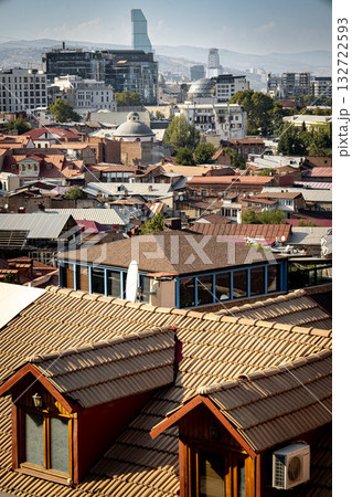 Contrast Of Old And Modern Architecture In Tbilisi Georgia: Traditional Rooftops Of The Historic District With Contemporary Skyscrapers In The Background Under Clear Sky 132722593