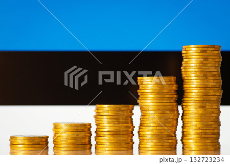 Stacks of golden coins forming uprising graph in front of Estonia flag. Concept of development of Estonian financial system Stacks of golden coins forming uprising graph in front of Estonia flag. Concept of development of Estonian financial system 132723234