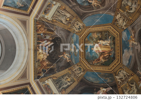 Ornate coffered ceiling with octagonal fresco panels blue and gold renaissance decoration Vatican Museums interior no people. High quality photo 132724806
