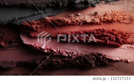 Crushed eyeshadow makeup in various shades of red, pink and brown is arranged in textured stripes, creating an abstract and colorful background ideal for beauty and cosmetics themes Crushed eyeshadow makeup in various shades of red, pink and brown is arranged in textured stripes, creating an abstract and colorful background ideal for beauty and cosmetics themes 132727153
