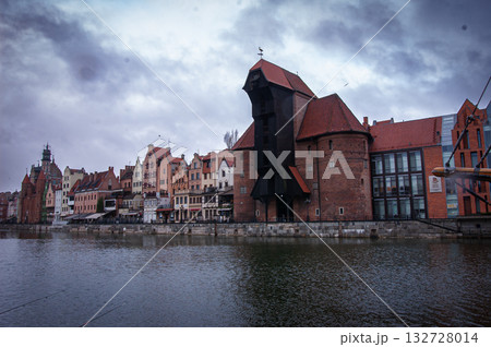The Zuraw Crane and colorful gothic facades of the old town in Gdansk, Poland, on sunset. High quality photo 132728014