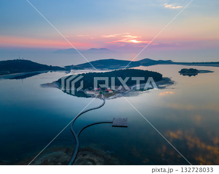 Aerial landscape photography. Fantastic morning view of St Mary's Monastery and wooden pier. Magnificent spring seascape of Narta Lagoon. Beautiful outdoor scene of Albania, Europe. 132728033