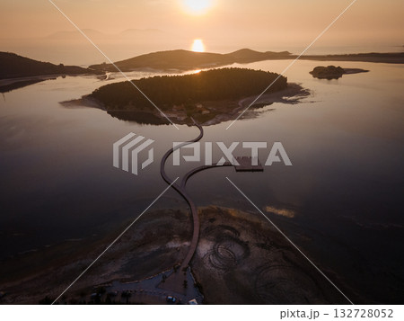 Aerial landscape photography. Fantastic morning view of St Mary's Monastery and wooden pier. Magnificent spring seascape of Narta Lagoon. Beautiful outdoor scene of Albania, Europe. 132728052