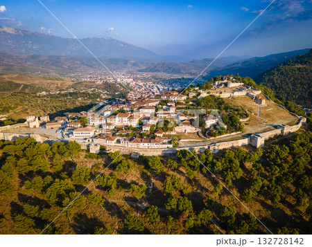 Aerial view of the old Castle of Berat and its ancient neighborhoods in sunset light, located in Albania. Photo taken with drone 132728142
