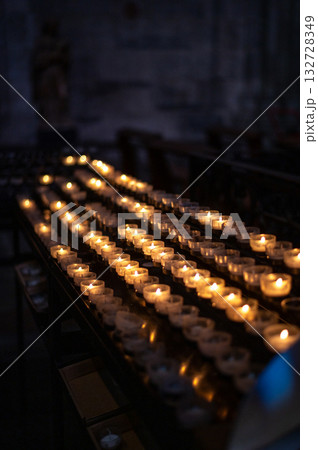 A serene scene of glowing candles inside Cologne Cathedral, Germany. A serene scene of glowing candles inside Cologne Cathedral, Germany. 132728349