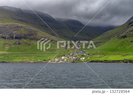Scenic view of the picturesque village of Bour with turf-roof houses, as seen from Drangarnir cliff. 132728564