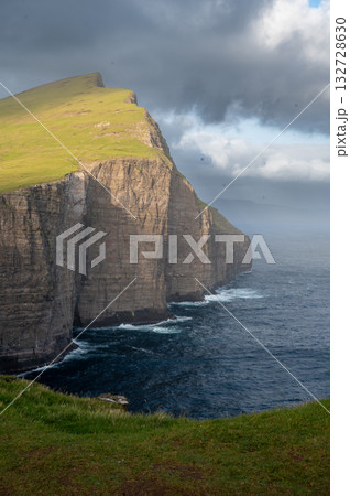 Scenic viewpoint on Traelanipa trail, overlooking dramatic basalt cliffs and vast volcanic rock formations above the ocean. Scenic viewpoint on Traelanipa trail, overlooking dramatic basalt cliffs and vast volcanic rock formations above the ocean. 132728630