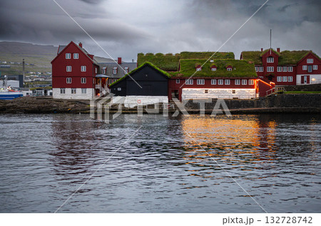 Torshawn city, the capital of The Faroe Islands, Denmark. Vestaravag harbor in Torshavn with its boats and colorful buildings. High quality photo Torshawn city, the capital of The Faroe Islands, Denmark. Vestaravag harbor in Torshavn with its boats and colorful buildings. High quality photo 132728742