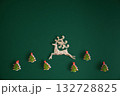 Festive dark green Christmas background decorated with ornaments, baubles, and holiday lights, creating a cozy seasonal atmosphere. 132728825