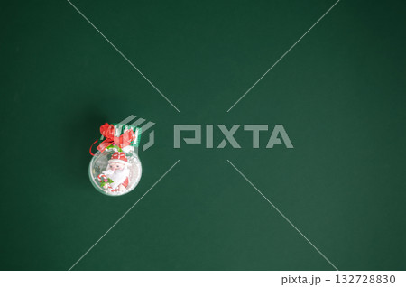 Festive dark green Christmas background decorated with ornaments, baubles, and holiday lights, creating a cozy seasonal atmosphere. Festive dark green Christmas background decorated with ornaments, baubles, and holiday lights, creating a cozy seasonal atmosphere. 132728830