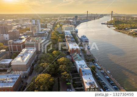 Aerial view of Savannah, old historical city in Georgia. River Street buildings architecture at night Aerial view of Savannah, old historical city in Georgia. River Street buildings architecture at night 132730450