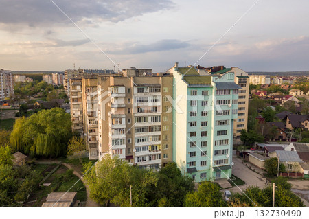 Aerial view of multistory apartment buildings in green residential area. Aerial view of multistory apartment buildings in green residential area. 132730490