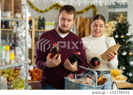 Married couple chooses alcohol in a store with interest 132730541