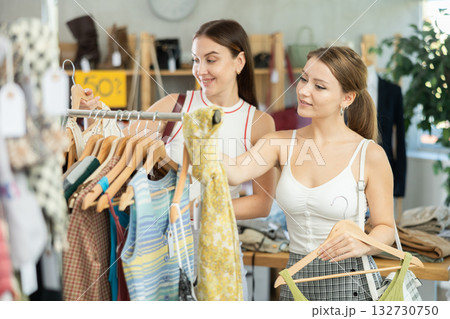 Two women choosing clothes in a store 132730750