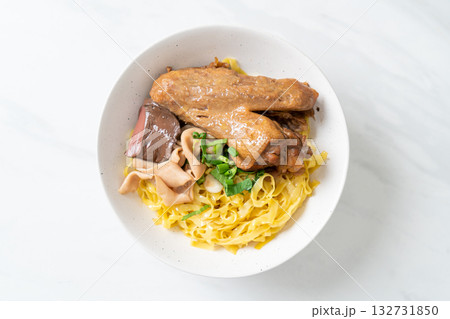 Egg noodles served dry with braised duck Egg noodles served dry with braised duck 132731850