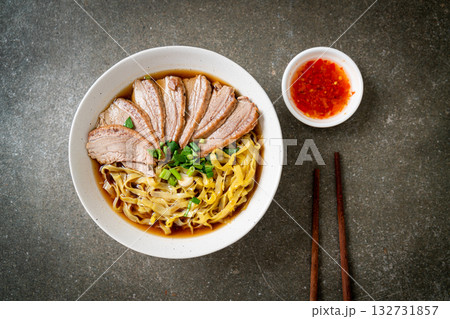 egg noodles with stewed duck in brown soup egg noodles with stewed duck in brown soup 132731857