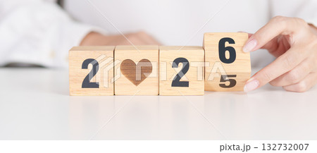2025 end year to Happy New Year 2026 with heart block for health care, love, organ donation, resolution, charity, happy family, wellbeing and insurance concepts 132732007