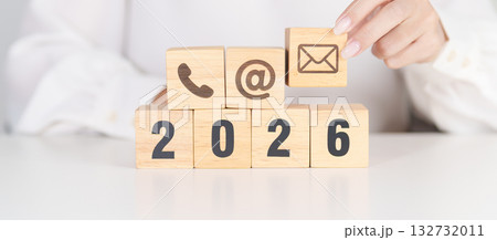 Happy New Year 2026 block for Contact Us concepts. Wood block of Email, call Phone and Website Address sign. For Customer support hotline, business Marketing, Corporate, communication and Advertising 132732011