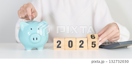 2025 end year to Happy New Year 2026 with piggy bank. Resolution, Goals, Plan, Action, Money Saving, Retirement fund, Pension, Investment and Financial concepts 132732030