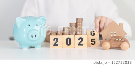 2025 end year to Happy New Year 2026 with car and Home model with coin stack. Car loan, Interest rate, real estate, house, Insurance, Financial, Repair, Tax, mortgage and Maintenance 132732038