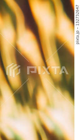 Blur wavy glow. Leak illumination. Yellow white reflection blending hot color abstract dark background. Optical art effect overlay. Blur wavy glow. Leak illumination. Yellow white reflection blending hot color abstract dark background. Optical art effect overlay. 132732647