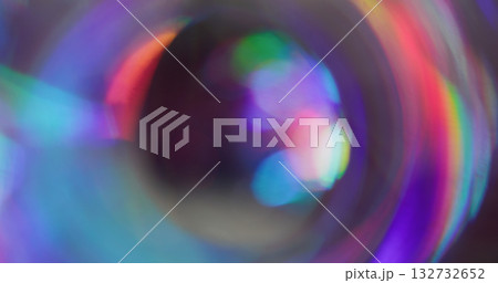 Iridescent blur glow. Whirl futuristic flare. Red purple blue light mixing color on black background. Neon reflection abstract luminosity. 132732652