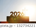 New Year's sunrise in 2026, with the bright rising sun and the Holy Cross of Jesus Christ and the Bible in the background. 132734221