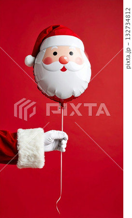 Santa Hand Holding Santa-shaped Balloon 132734812