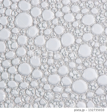 The texture of the foam of shower gel or soap suds. Macrophotography 132735010