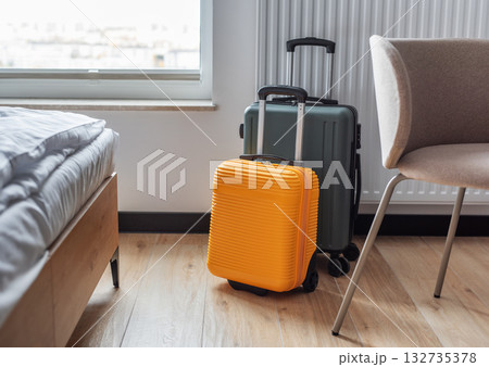 Suitcases standing in modern hotel room ready for travel 132735378