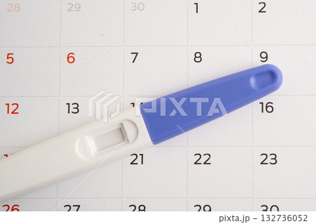 Pregnancy test and birth control pills on calendar, contraception health and medicine. Pregnancy test and birth control pills on calendar, contraception health and medicine. 132736052