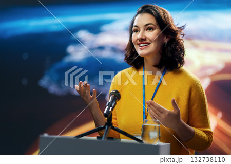woman is giving a presentation at conference woman is giving a presentation at conference 132738110