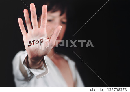 Woman's hand with written stop Woman's hand with written stop 132738378