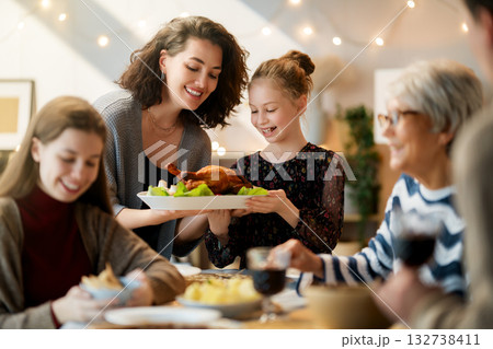 Family celebrating Thanksgiving Day Family celebrating Thanksgiving Day 132738411