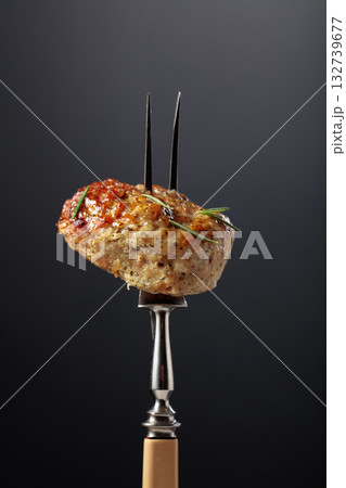 Homemade pork-beef cutlet on a black background. Homemade pork-beef cutlet on a black background. 132739677