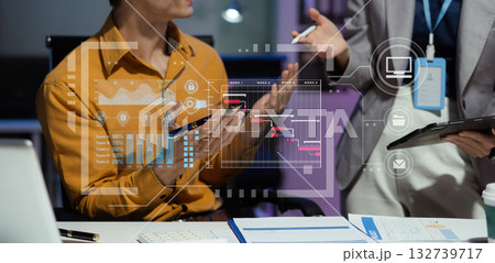 Businessman hand Project manager working overtime and update tasks and Gantt chart scheduling virtual diagram.with laptop in office. 132739717